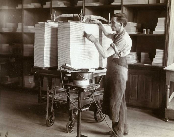 Man glueing tablets at the J.C. Blair Company in Huntingdon